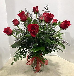One dozen roses in a vase