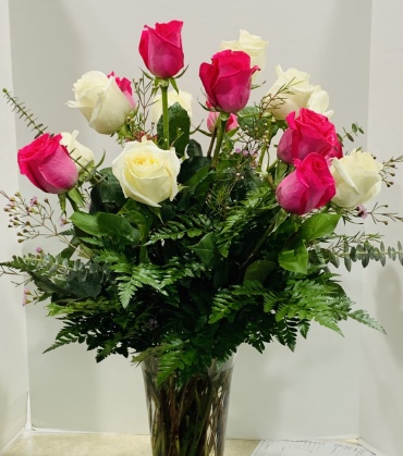 18 multicolored roses in a vase