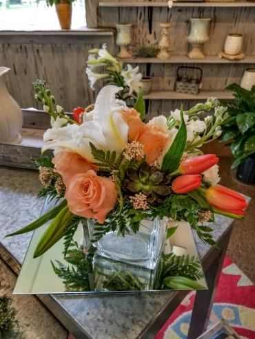 Lilies and tulips in a cube